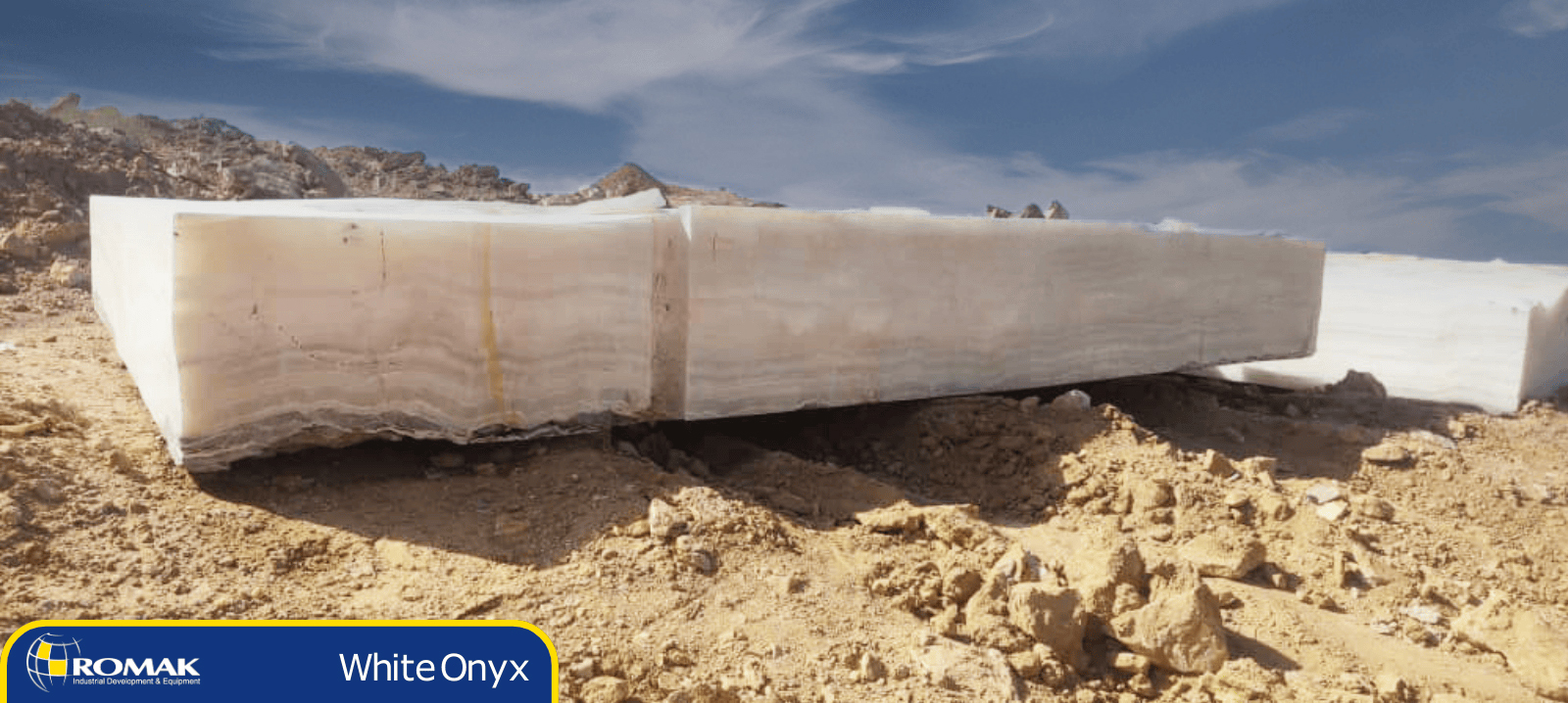 Transform Your Interiors with Elegant Iranian White Onyx from Romak Trading Premium Iranian white onyx featuring delicate gray and beige veins, offering a clean and luxurious appearance for modern interiors.