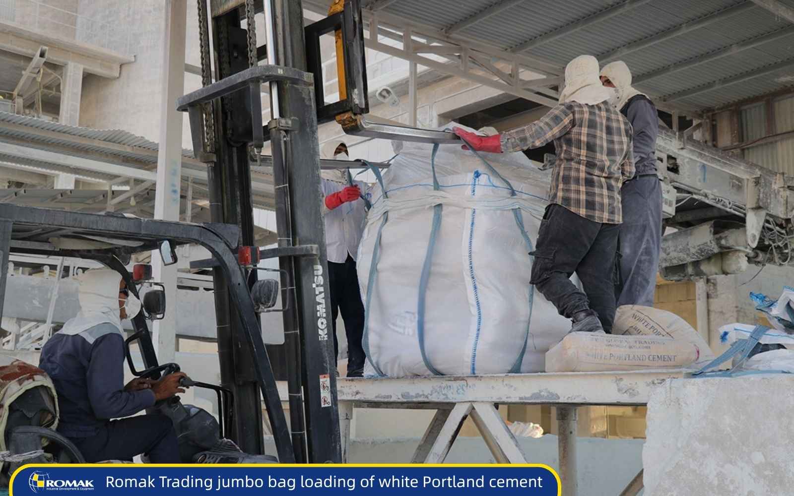 Romak Trading jumbo bag loading of white Portland cement in Iran Romak Trading workers loading white cement jumbo bags with forklift at packaging facility in Iran